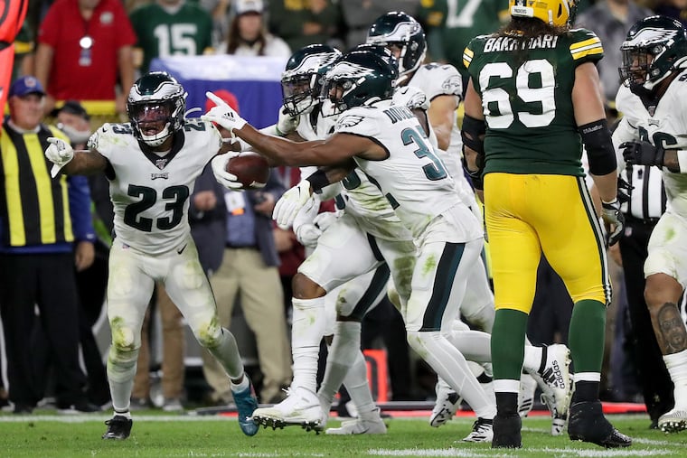 Philadelphia Eagles outside linebacker Nigel Bradham, second from left, celebrates with his teammates after intercepting a late 4th quarter pass against the Packers. Philadelphia Eagles win 34-27over the Green Bay Packers at Lambeau Field in Green Bay, WI on September 26, 2019.