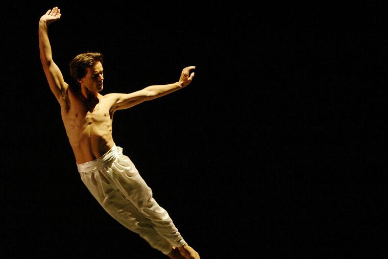 PARSONS -- Dancer Angel Corella participates in a dress rehearsal of "Caught" at New York University in New York, Thursday, Oct. 2, 2003. In choreographer David Parsons' stunning dance Corella quite literally flew _ thanks to one strobe light, one inventive choreographer, one perfect dancer's body and 90 exhausting jumps. (AP Photo/ Mike Appleton)