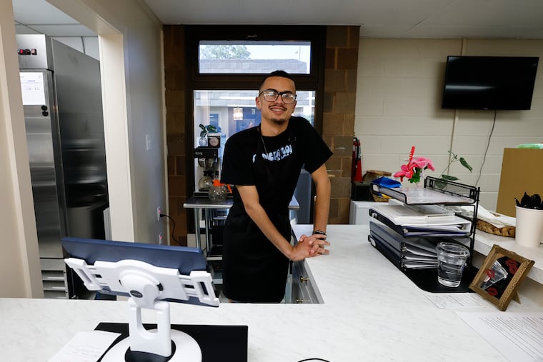 Barista Victor Perez, 19, at the Inclusion Cafe inside the Vineland Public Library in Cumberland County on Thursday. The cafe seeks to create jobs for adults with disabilities in a supportive environment.