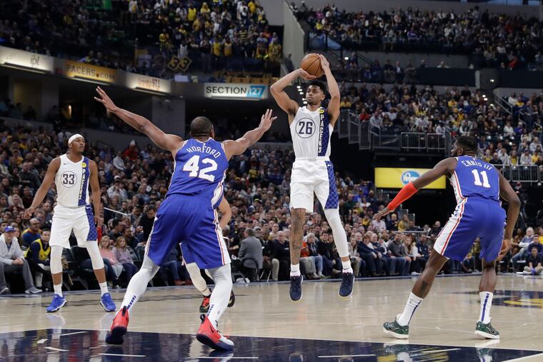 Indiana's Jeremy Lamb puts up a shot against the Sixers' Al Horford in Thursday's 115-97 loss to the Pacers at Bankers Life Fieldhouse.