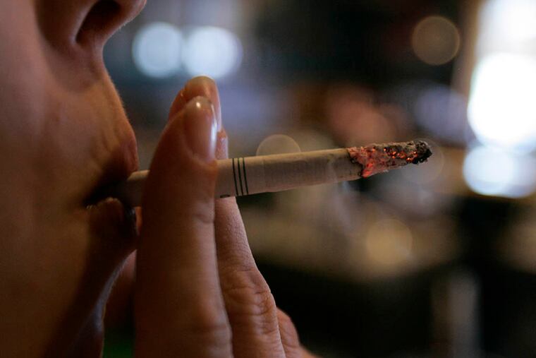 CVS is offering its employees a monetary deposit-based program to quit smoking beginning next month. (CAROLYN KASTER / AP, File)