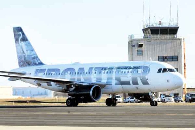 Flights going to and from Orlando, FLA via Frontier Airlines at Trenton-Mercer County Airport on Jan. 18, 2013. Here, a jet that has just arrived from Florida. APRIL SAUL / Staff Photographer