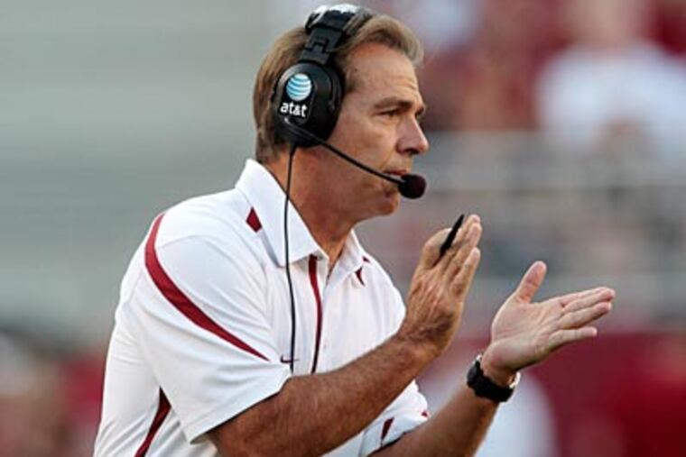Like Joe Paterno, Alabama coach Nick Saban is keeping his quarterback options open. (Dave Martin/AP)