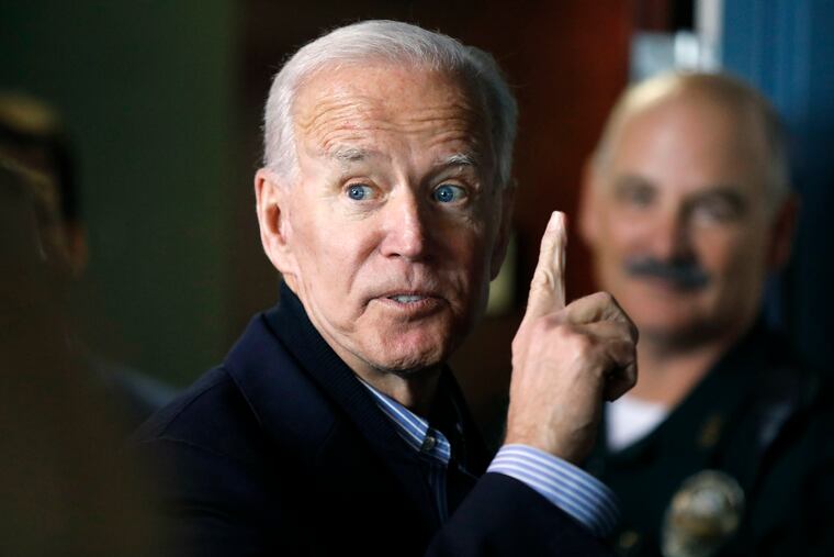 In this May 13, 2019, photo, former vice president and Democratic presidential candidate Joe Biden interacts with a supporter during a campaign stop at the Community Oven restaurant in Hampton, N.H.
