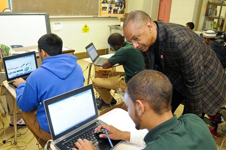 Charles Baltimore, principal at Thomas Alva Edison High School and John C. Fareira Skills Center, oversees a student. RON TARVER / Staff Photographer