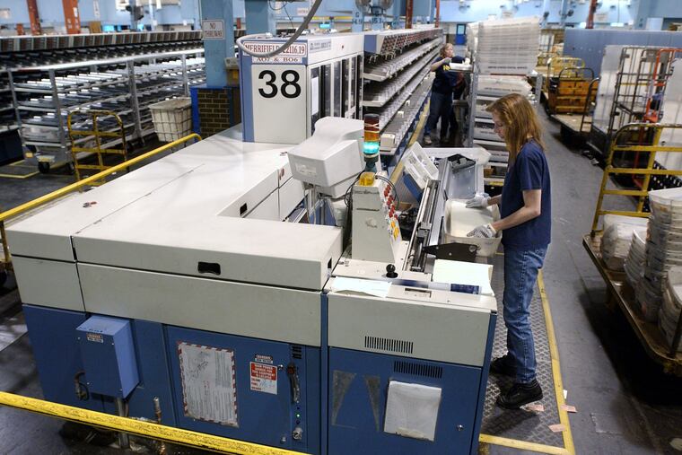 USPS bar-code scanner, one of the labor-saving devices the Postal Service has installed in a so-far unsuccessful effort to break even.