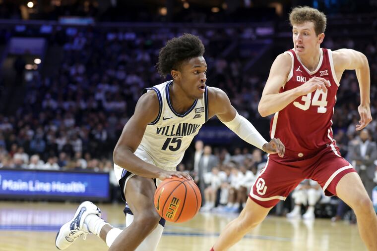 Jordan Longino of Villanova drives against Jacob Groves of Oklahoma on Dec. 3 at the Wells Fargo Center.