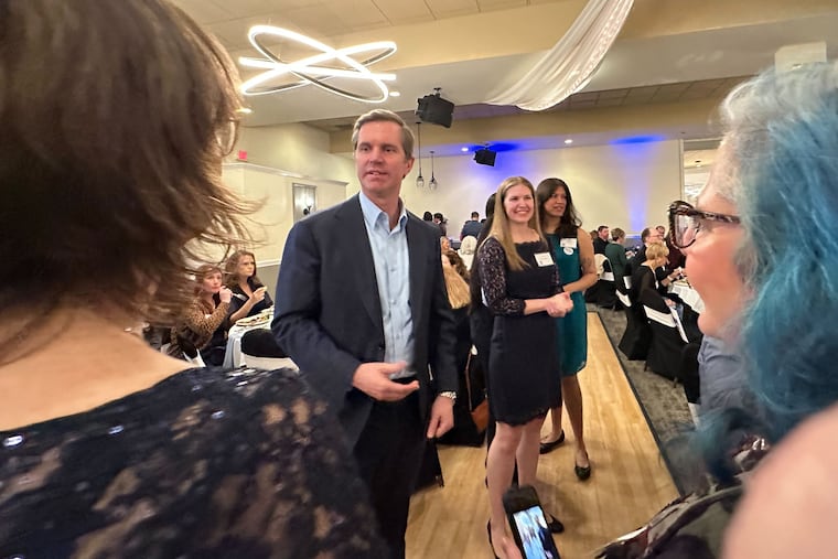Kentucky Gov. Andy Beshear mingles with the audience at a Democratic fundraiser in Butler County, Ohio, March 21, 2026.