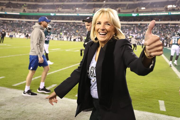 First Lady Jill Biden gives a thumbs-up as she walks along the sideline before the Eagles played the Cowboys at Lincoln Financial Field in October.