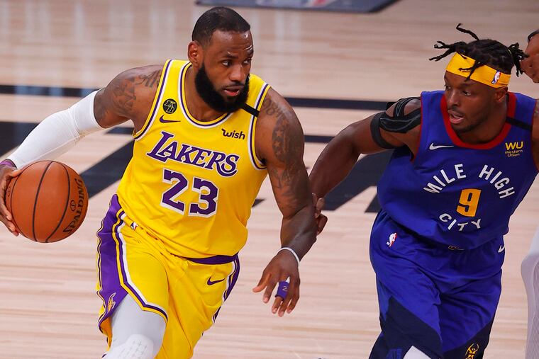 The Los Angeles Lakers' LeBron James (23) drives against the Denver Nuggets' Jerami Grant (9) during the Western Conference Finals at AdventHealth Arena in Lake Buena Vista, Fla.