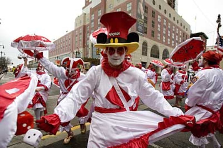 Zack Kreschollek, 16, of South Philly, and the Holy Rollers N.Y.B. comics strut up South Broad Street near the front of the 2008 Mummers Parade. (Ed Hille / Staff Photographer)