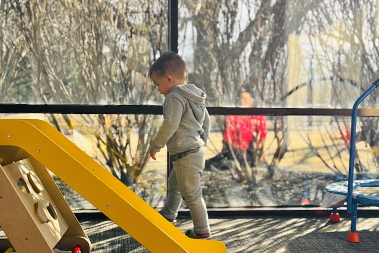 A child walks in the play area at the new CHOP-Soar Autism Center in Newtown. CHOP and its partner, Soar Autism Centers, plan a network of such centers in the Philadelphia region that could grown into the dozens.