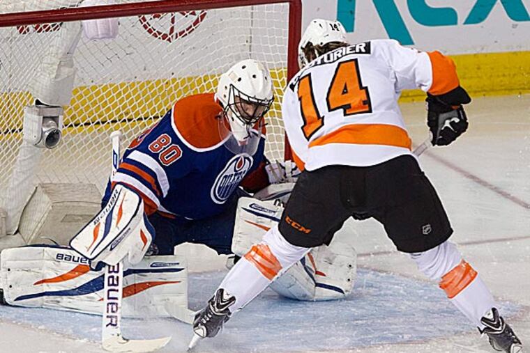 The Flyers' Sean Couturier is stopped by Oilers goalie Ilya Bryzgalov. (Jason Franson/The Canadian Press/AP)