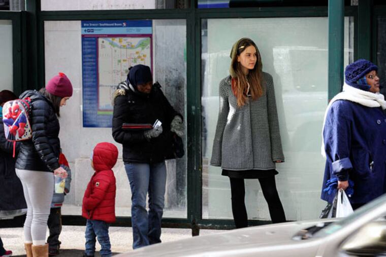 Avi Loren Fox models her Wild Mantle on Eighth Street. Her Wild Mantle business raised money on Kickstarter.