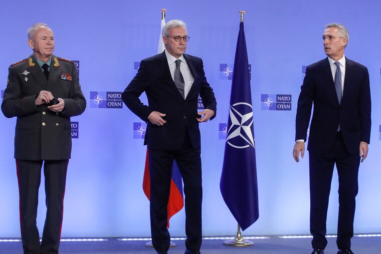 NATO Secretary General Jens Stoltenberg (right) welcomes Russian Deputy Foreign Minister Alexander Grushko (center) and Russian Deputy Defense Minister Alexander Fomin before the NATO-Russia Council at NATO headquarters in Brussels on Wednesday.
