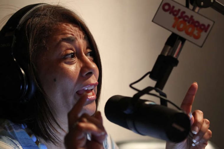 Dyana Williams reacts to a caller during their "Battle of the Bands" segment when the callers call in and vote for either Whitney Houston or Mariah Carey. WRNB radio. For a piece on the changing face of urban radio in Philly, we'd like to get a photo of Dyana Williams at work. She's the doyenne of the "old-school" sound on RNB. We'd like to get a shot of her behind the mic, doing her show. It goes from 10 a.m. to 3 p.m. on Sundays. 08/25/ 2103( MICHAEL BRYANT / Staff Photographer )