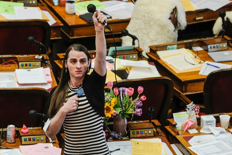 State Rep. Zooey Zephyr, alone on the House floor, stands in protest as demonstrators are arrested in the house gallery on April 24 at the Montana State Capitol.