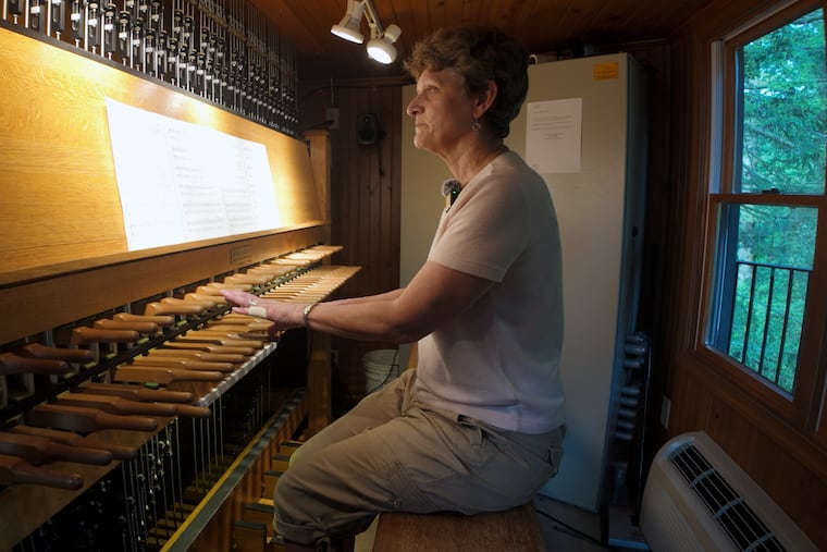 Carillonneur Lisa J. Lonie performs on the 62-bell carillon inside Chimes Tower at Longwood Gardens. The instrument is celebrating its 25th anniversary with live performances featuring classical works, Disney songs, and pop music.
