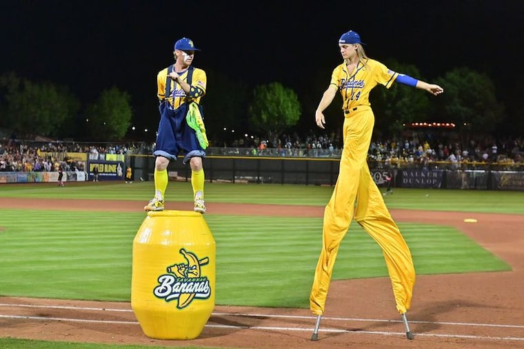 Savannah Bananas pitchers Mat Wolf, left, and Dakota Albritton dance in the fourth inning against the Savannah Party Animals at Scottsdale Stadium on March 31, 2023.
