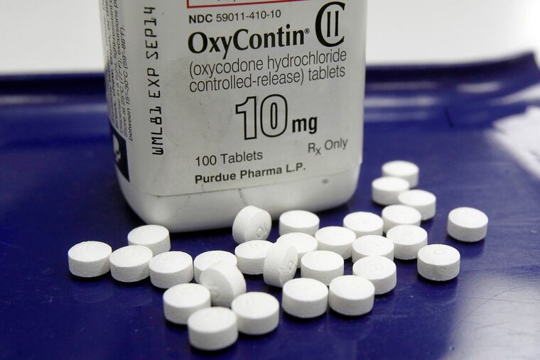 FILE – This Feb. 19, 2013, file photo shows OxyContin pills arranged for a photo at a pharmacy in Montpelier, Vt. Purdue Pharma, the maker of the prescription opioid painkiller OxyContin, is asking a judge in Alaska to dismiss a lawsuit that blames the company for the state's epidemic of opioid abuse. (AP Photo/Toby Talbot, File)