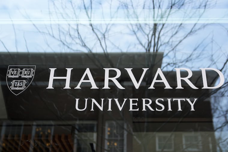 The Harvard University logo is displayed on a building at the school in Cambridge, Mass.