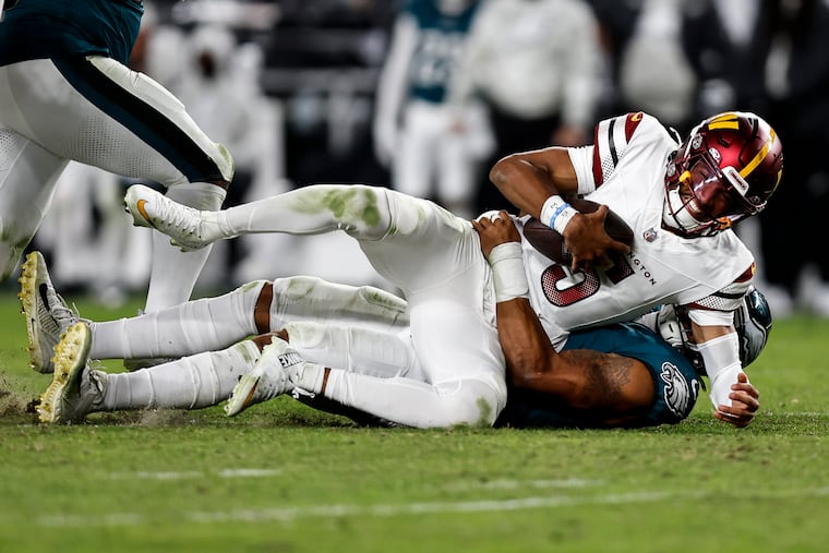 Commanders quarterback Jayden Daniels gets sacked by Eagles linebacker Nolan Smith on Nov. 14.
