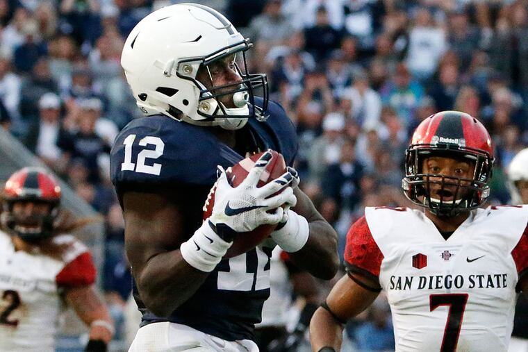 Penn State wide receiver Chris Godwin (12) hauls in a pass from quarterback Christian Hackenberg.