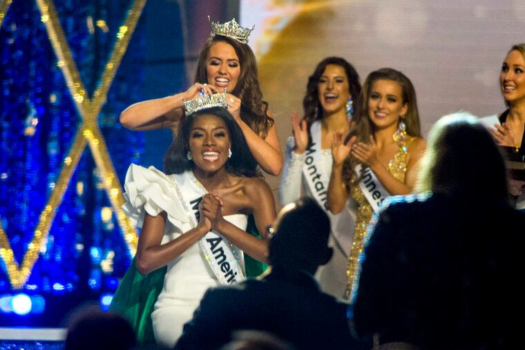 Miss America 2018 Cara Mund places the tiara on Miss New York Nia Imani Franklin as she is crowned Miss America 2019.