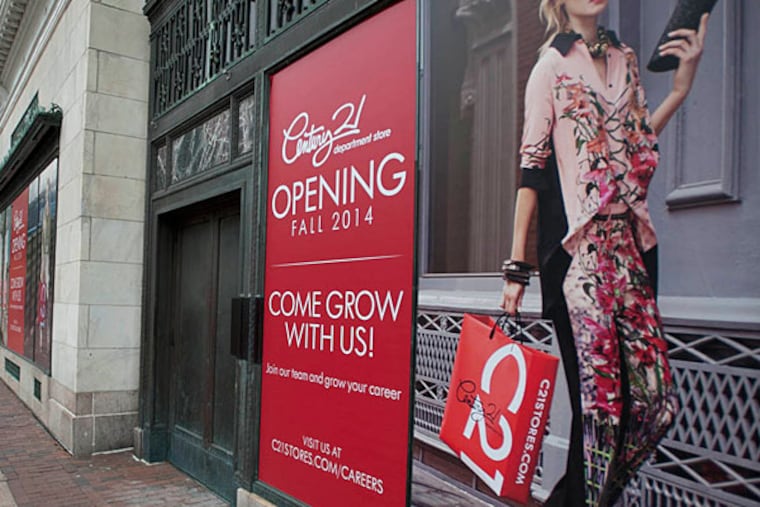 A sign along Market Street announces the Century 21 store opening in The Gallery. (RON TARVER / Staff Photographer)