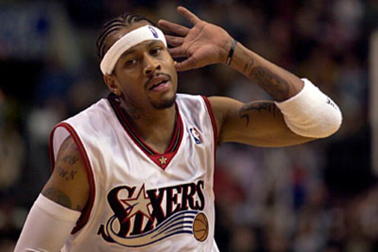 Sixers' Allen Iverson puts his hand to his ear, urging the crowd to make noise. 'The Answer" is scheduled to return to the Sixers on Monday night against the Nuggets, another of his former teams. (Steven M. Falk / File photo)