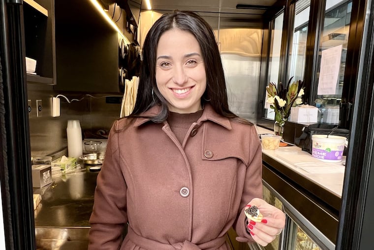 Lauren Biederman at her kiosk, Biederman's Caviar, on the corner of 19th and Arch Streets.