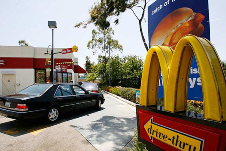 Cars enter the drive thru at a McDonald's in El Segundo, Calif. (AP Photo/Nick Ut)