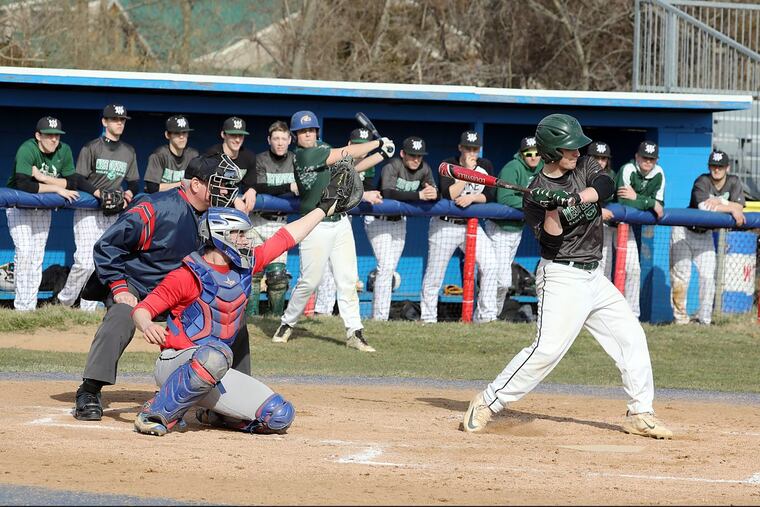 Umpire,Jim Tumolo, Washington Township catcher Anthony Buffone and West Deptford batter Rick Templeton enjoy a rare day outdoors.