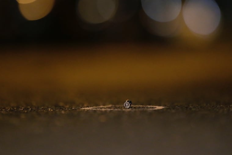 One of many shell casings on the 6700 block of Regent Street in Southwest Philadelphia, where at least 3 people were shot Saturday night near McCreesh Playground and Skatepark.