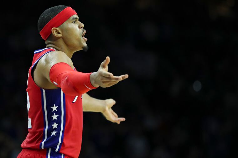 Sixers' forward Tobias Harris celebrates with the crowd after he makes a shot late in the fourth quarter.