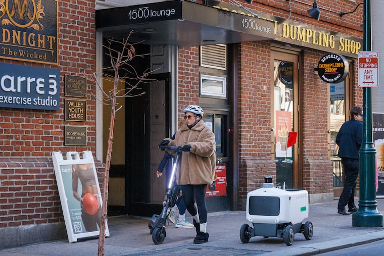 An Uber Eats delivery robot is seen on a sidewalk along 1500 Sansom Street last month.