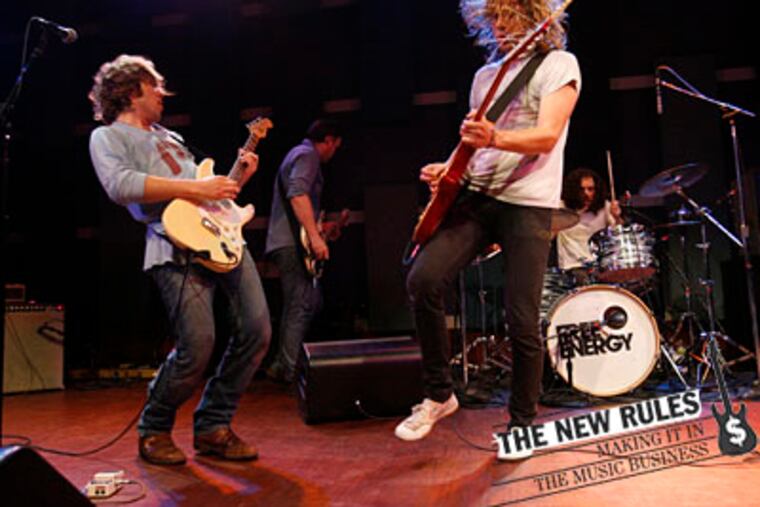 Free Energy at World Cafe Live: From left, Geoff Bucknum (guitar), Evan Wells (bass), Scott Wells (guitar) and Nicholas Shuminsky (drums). Live gigs are a big part of the band's efforts to amp up its earnings.