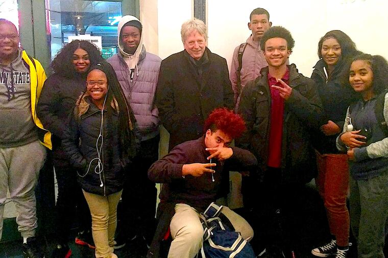 Tim Whitaker (center) is the executive director of Mighty Writers, an organization that provides mentorship to youth.