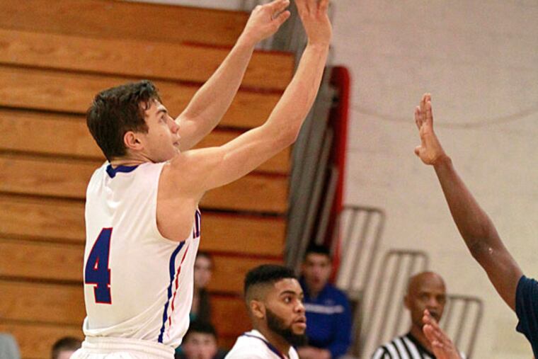 Spencer Cook, left, of Washington Twp. shoots a 3-point shot with 3.9
seconds left in overtime to give Washington Twp. a 62-60 victory over
Timber Creek in boys' basketball on Jan. 29, 2015. (Charles Fox/Staff Photographer)
