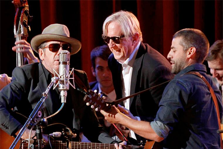 Elvis Costello, T Bone Burnett, and Oscar Isaac perform during the concert 'Another Day, Another Time: Celebrating the Music of 'Inside Llewyn Davis'" at New York's Town Hall.
