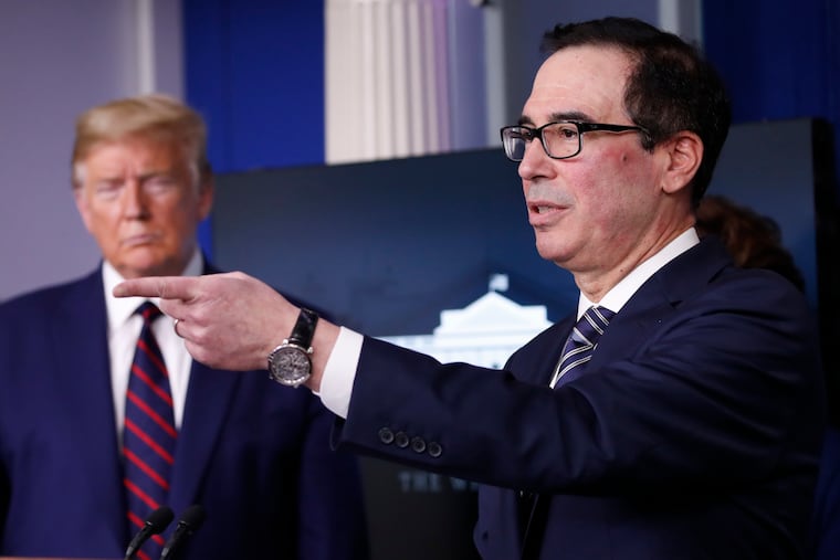 President Donald Trump listens as Treasury Secretary Steven Mnuchin speaks about the coronavirus in the James Brady Press Briefing Room of the White House, Thursday, April 2, 2020, in Washington.