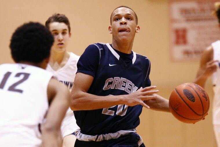 Isaiah Sanders of Timber Creek drives against Jalen Gaffney (12) of Westtown during the third quarter at the Play-by-Play Classic basketball tournament.