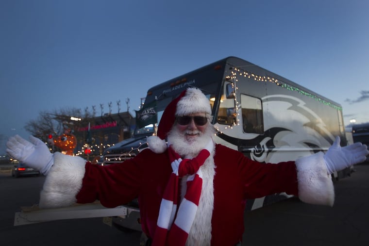 Fran Mulherin, of Williamstown, N.J., an Eagles fan who calls himself Franta Claus, smiles outside Lincoln Financial Field in Philadelphia before the game against the Oakland Raiders on Christmas Day, Monday, December 25, 2017.