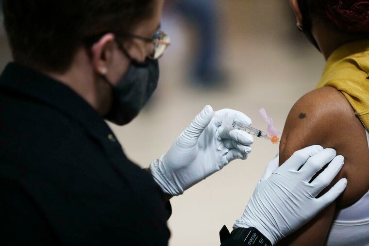 A person is administered a dose of the Johnson & Johnson COVID-19 vaccine at a city mass vaccination clinic at the Salvation Army at 55th and Market in West Philadelphia on Friday, March 26, 2021. (Heather Khalifa/The Philadelphia Inquirer/TNS)