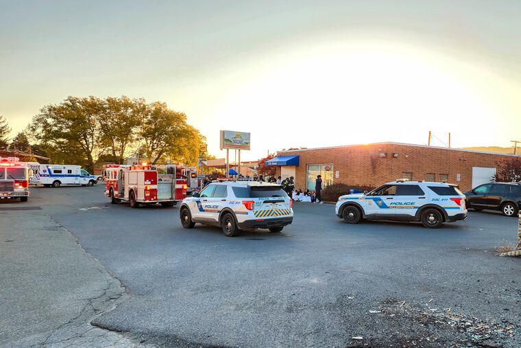 Emergency responders work on the scene of an apparent carbon monoxide leak at a day care center in Allentown on Tuesday.