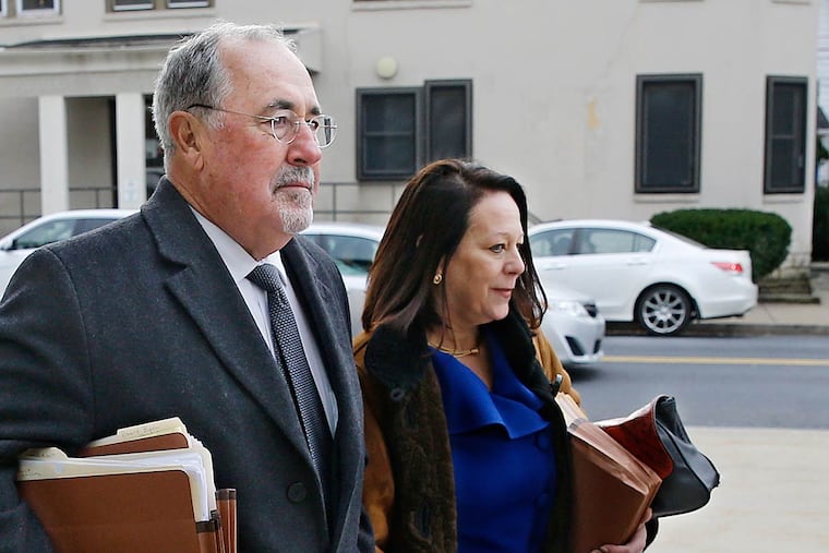 Supreme Court Justice J. Michael Eakin, left, and his wife, Heidi Eakin, right, arrive on Dec. 21, 2015, at the Northampton County Court of Common Pleas in Easton for a judicial discipline hearing.