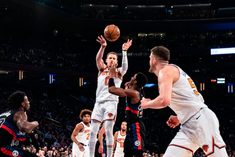 Donte DiVincenzo (left), a former Villanova star, broke the Knicks record for most three-pointers in the game (11) in a rout of the Pistons on Monday night.
