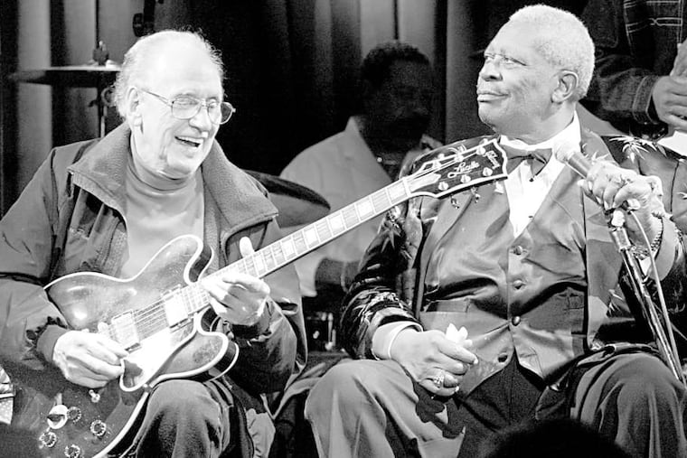 Les Paul (left), a pioneer of the electric guitar, playing on B.B. King's signature instrument, dubbed "Lucille," in a 2003 club date. King influenced many other legends of music with his impeccable style.