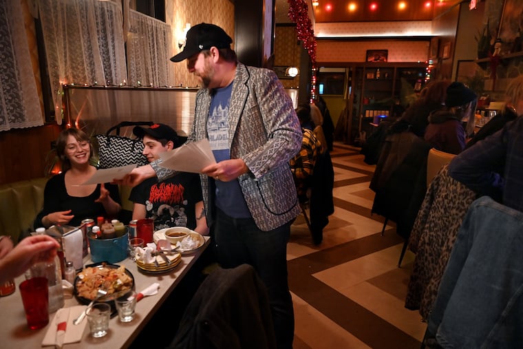Johnny Nottingham, performing as Johnny Goodtimes, hosts Quizzo Night at Loco Pez in South Philadelphia Feb. 28, 2022.