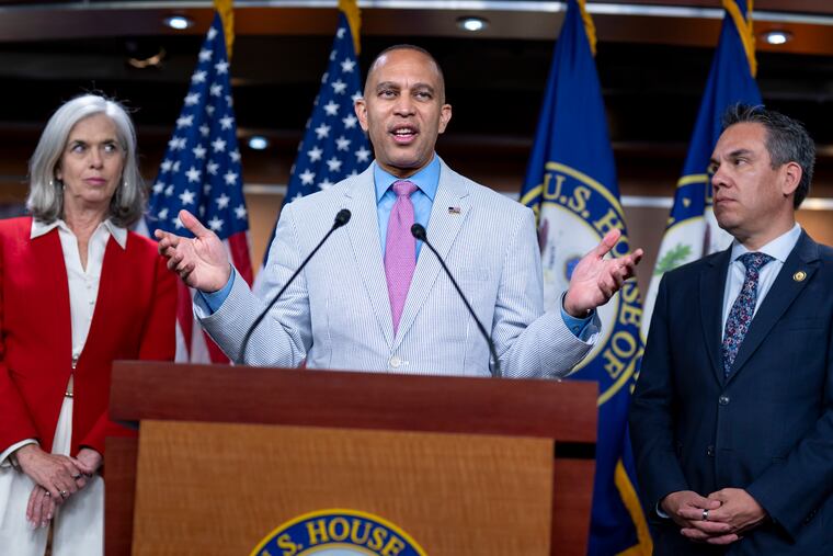 House Minority Leader Hakeem Jeffries, D-N.Y., flanked by Rep. Katherine Clark, D-Mass., left, the House minority whip, and Rep. Pete Aguilar, D-Calif., chair of the House Democratic Caucus, talks to reporters about the decision by Speaker Mike Johnson to leave Washington early as Republicans clash over the Jeffrey Epstein files.